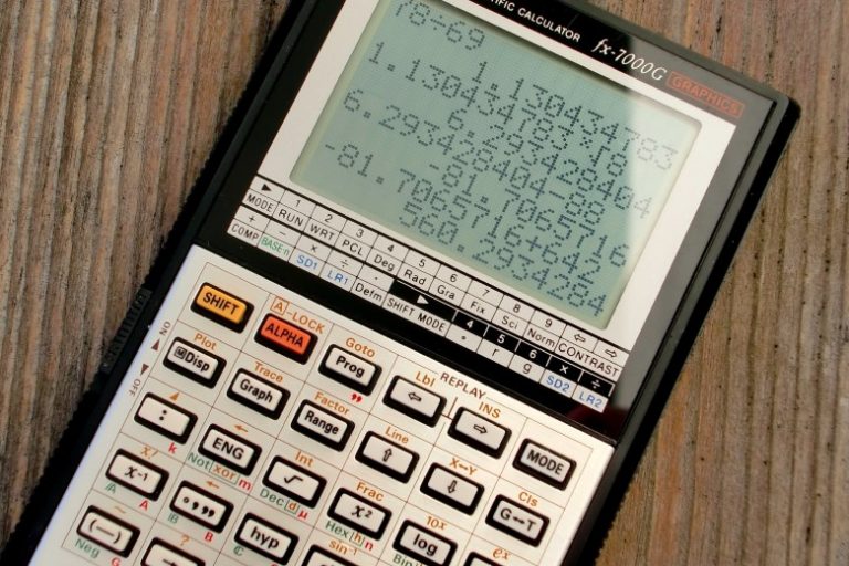 black-and-grey-casio-scientific-calculator-showing-formula-220301